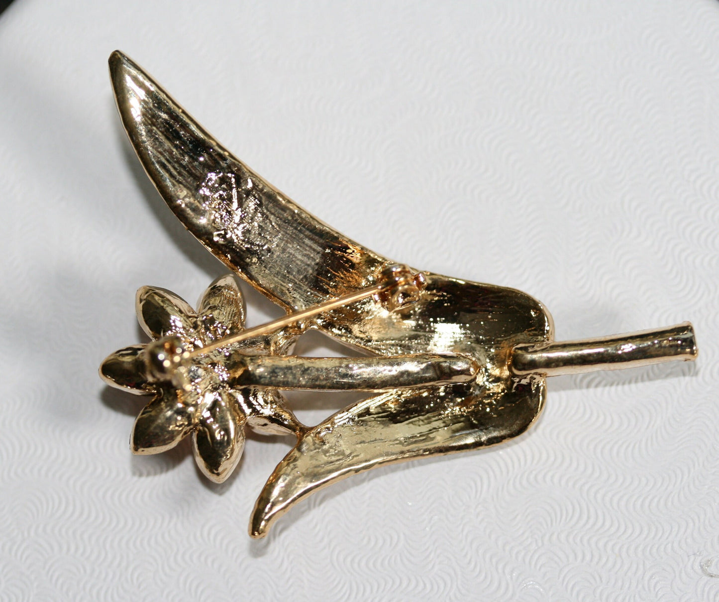 Pretty dainty vintage Topaz Tone /white Rhinestone Stemmed Flower Brooch