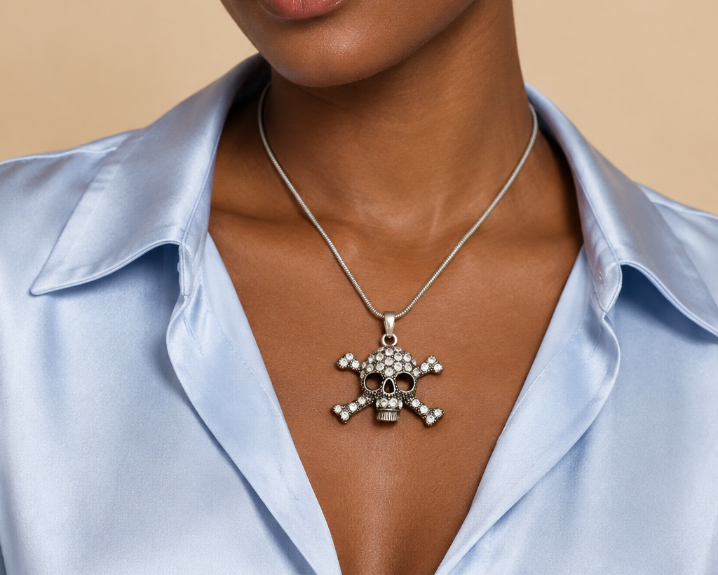 Model wearing skull pendant necklace